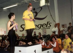 Two athletes on podium, enjoying their medals