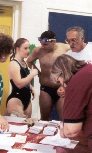 Athletes and Coaches at registration table