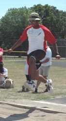 Athlete in middle of long jump